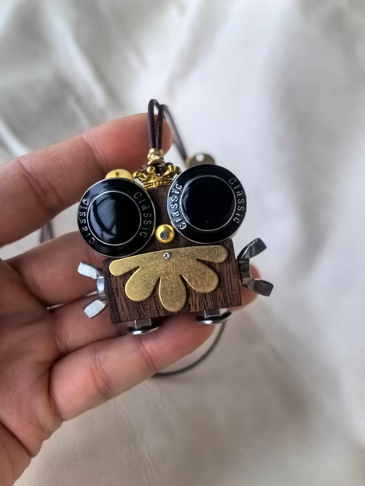 Onyx – Black Goggle Eyes & Golden Crown Double-Sided Robot Charm