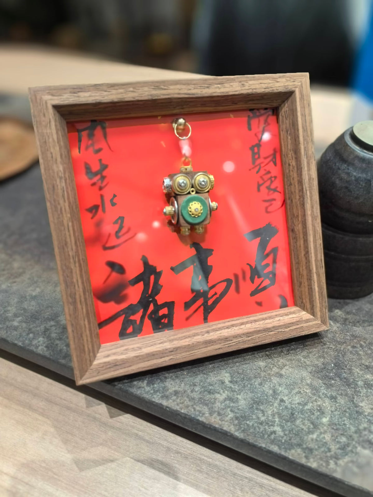 Golden-Eyed Steampunk Robot Pendant with Green Floral Detail